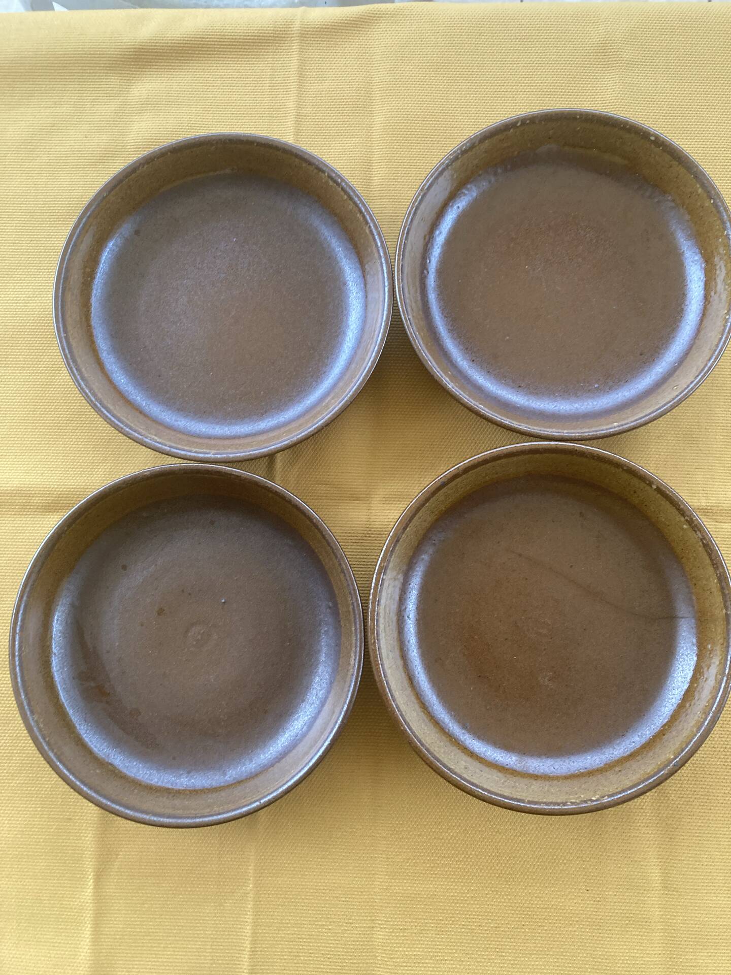 Deep plates made of organic, wild, earthy marsh clay.