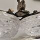 Crystal bowls joined by "swan neck" design.