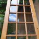 Old wooden door glazed with small tiles