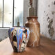 Vase dripping in varnished earth