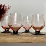 4 pink glasses with black stem