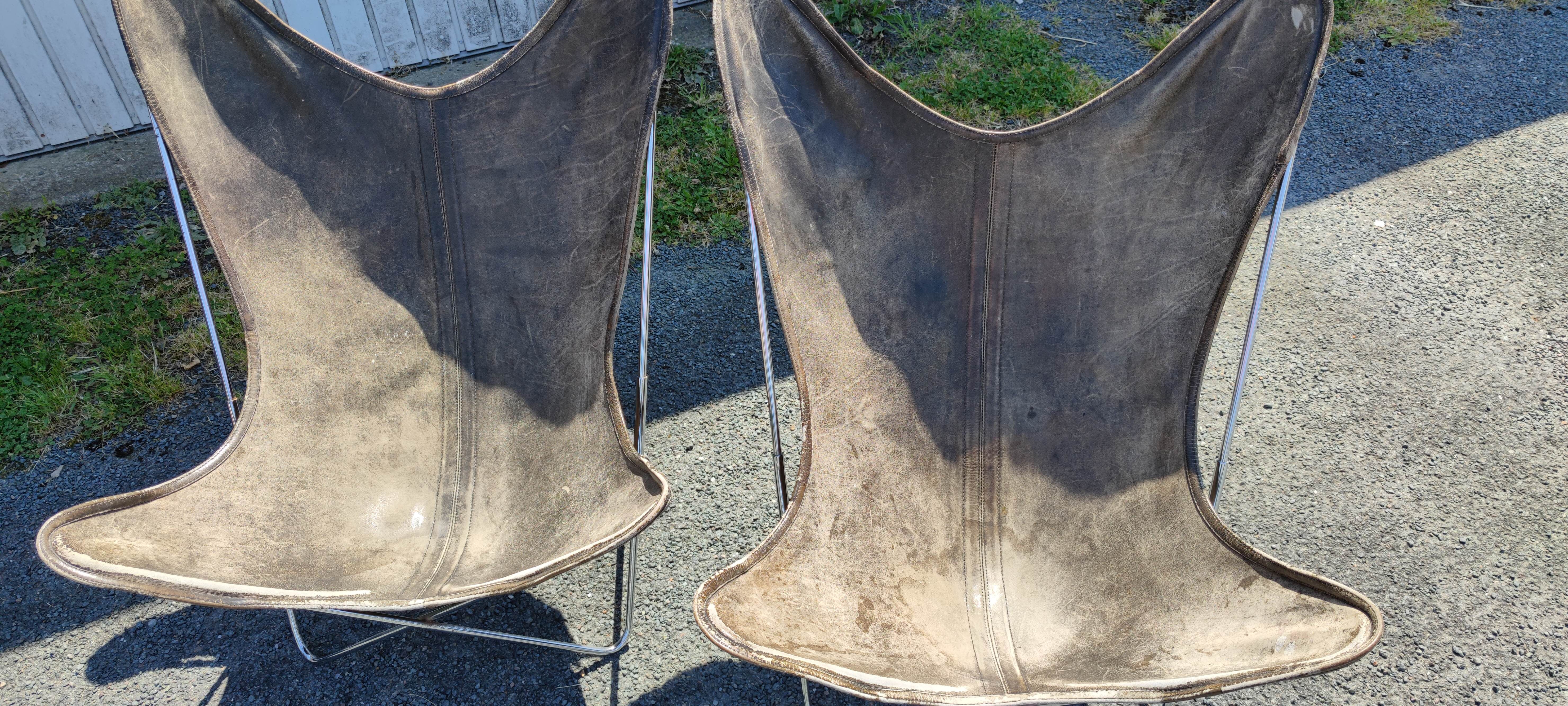 AA Butterfly leather armchairs
