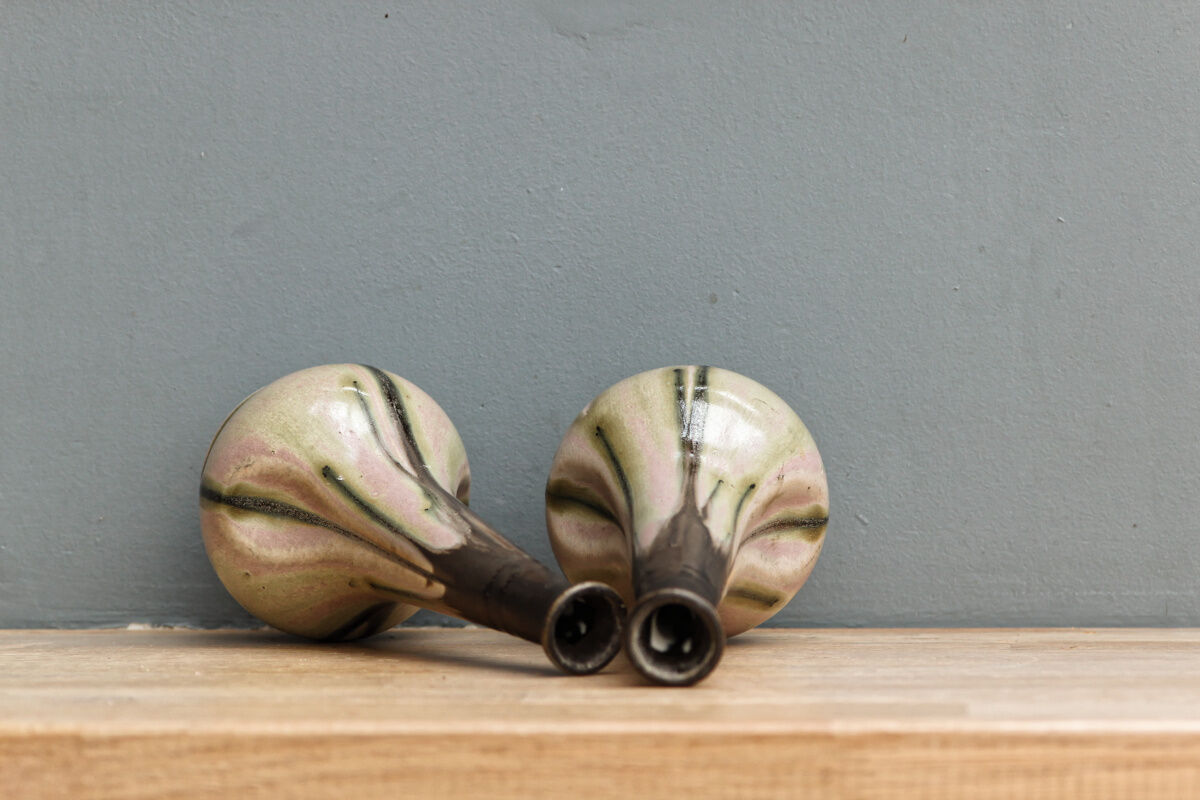 Pair of glazed sizzlings, signed