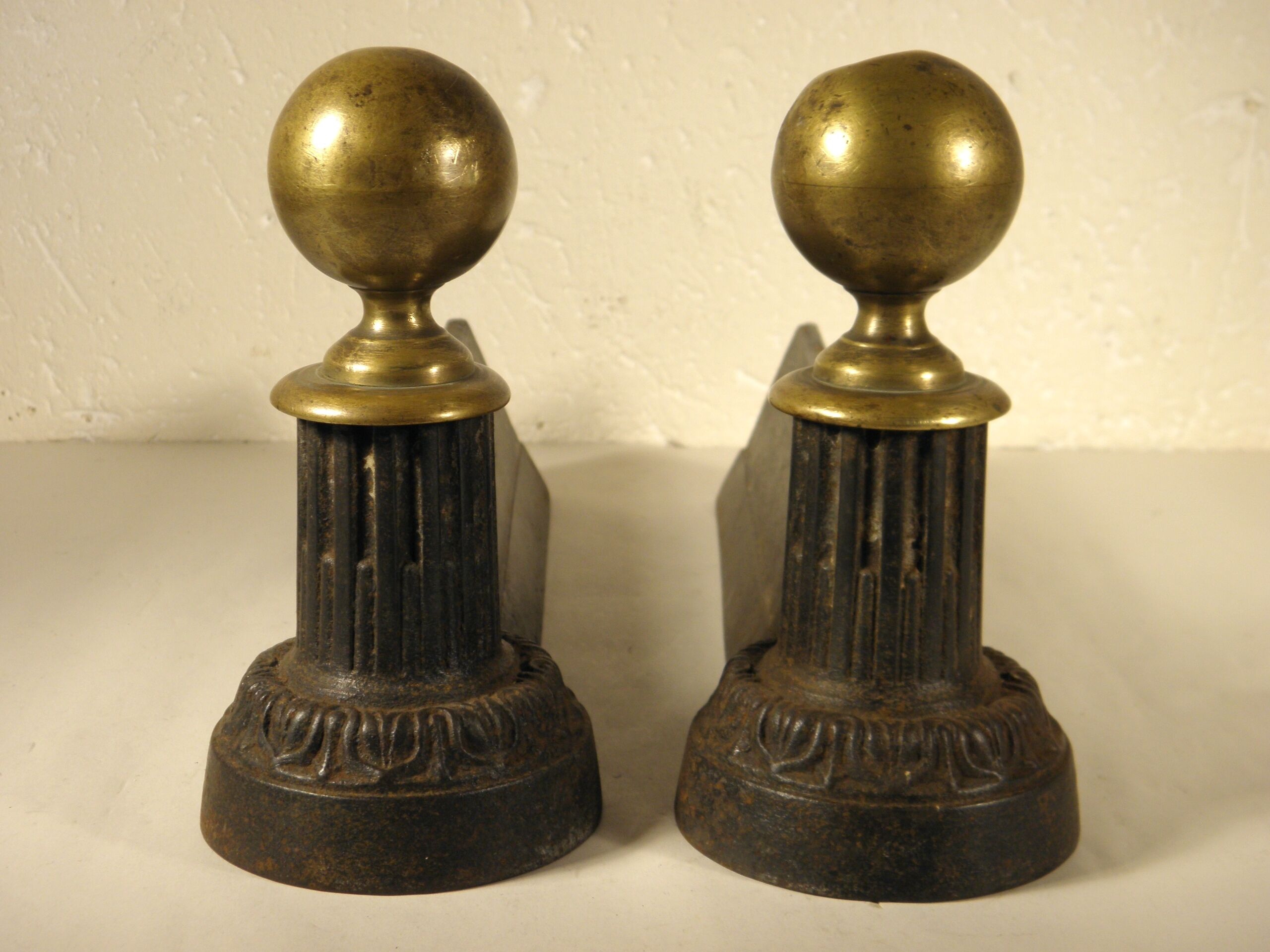 Pair of cast iron and brass chenets