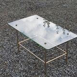 Vintage coffee table in gold and blackened metal with glass top from the 60s