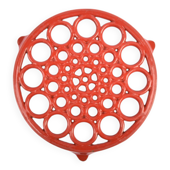 Vintage red enameled cast iron trivet