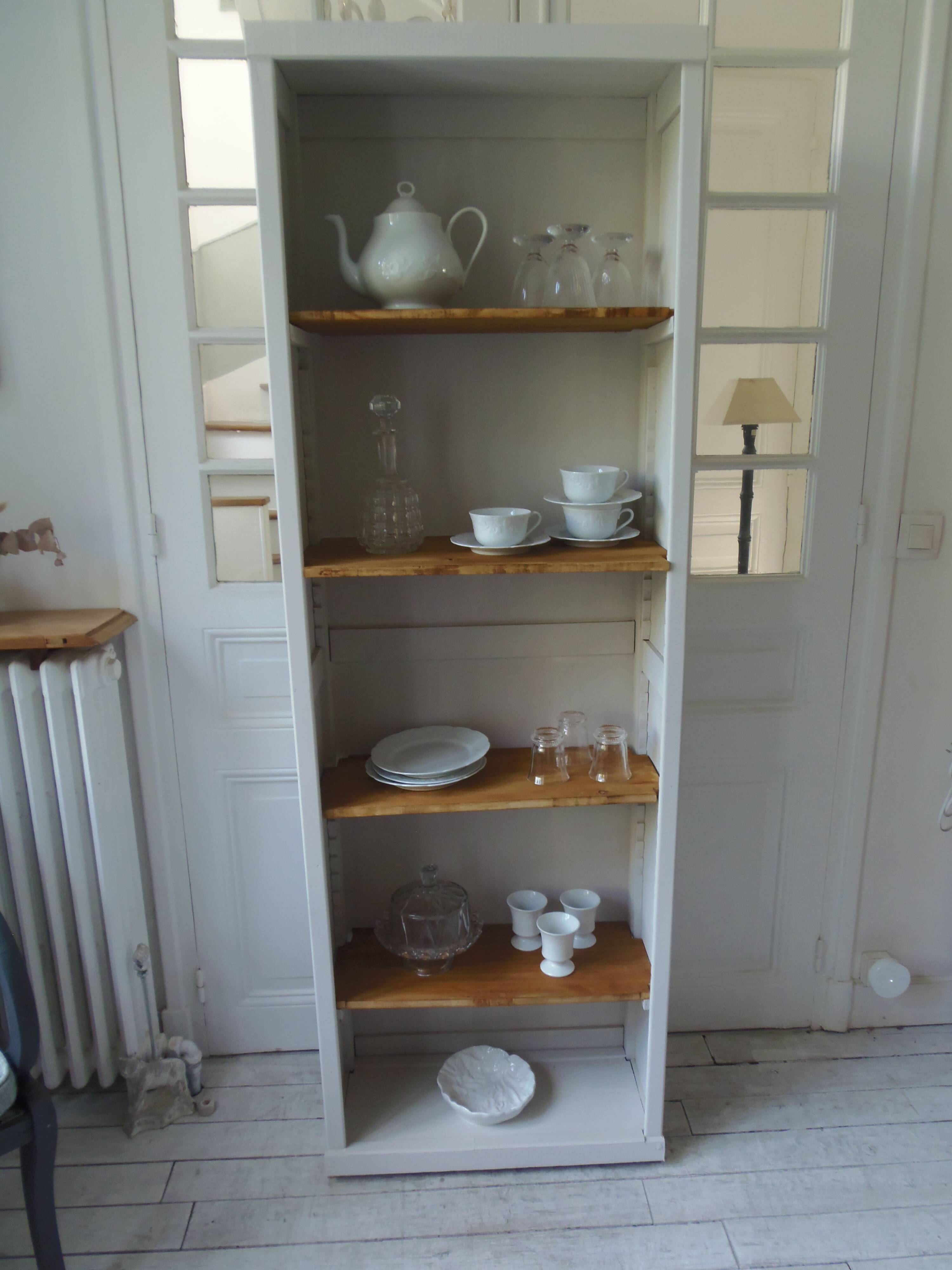 Shallow depth bookcase re-enchanted in pearl gray, wooden shelves.