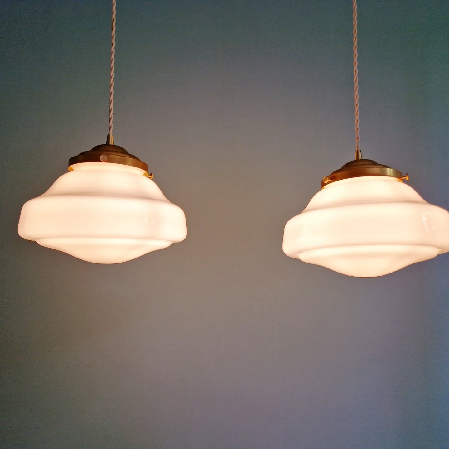 Pair of Art Deco pendant lights in white opaline.