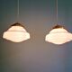 Pair of Art Deco pendant lights in white opaline.