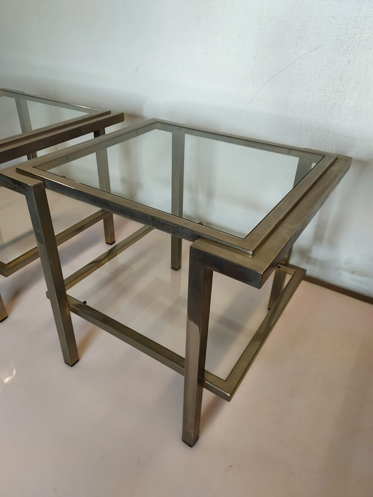 Pair of end of sofas in brushed iron signed Guy Lefevre