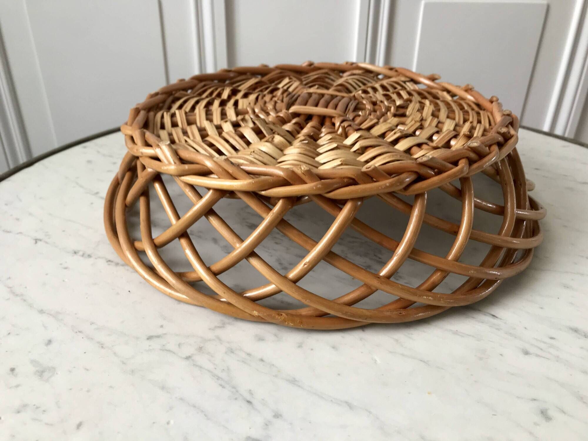 trio of woven rattan and bamboo baskets from the 60s and 70s
