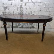 Oval Louis XVI style table with semi-circular extensions.