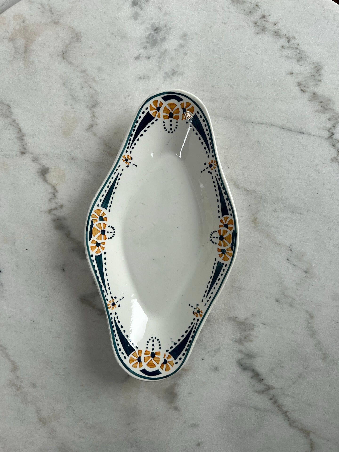 Longwy ramekin with blue and orange floral decoration.