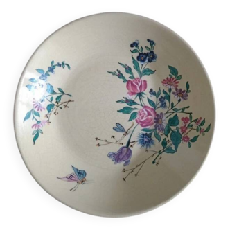 Decorative French earthenware plate with a floral bouquet and butterfly motif