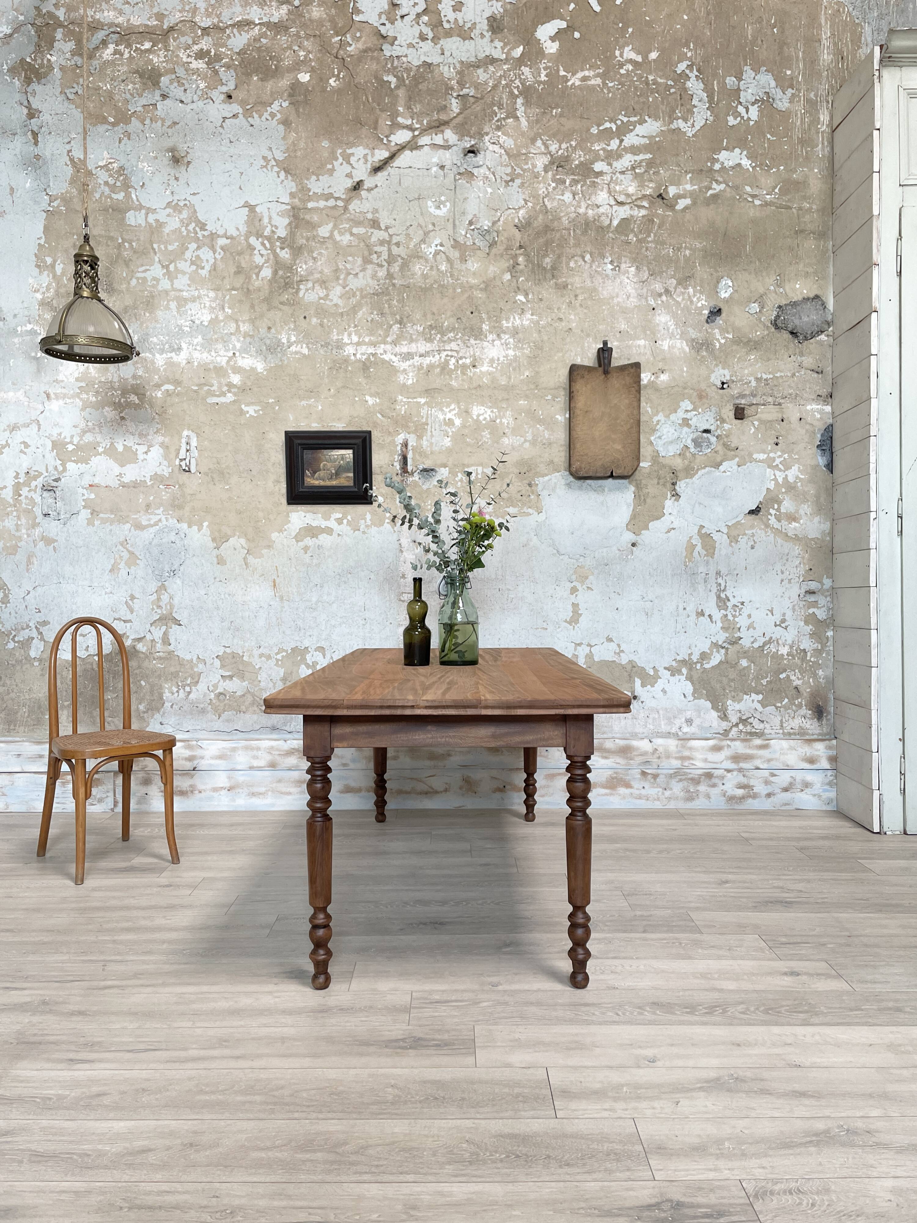 Vintage farmhouse table with turned legs.