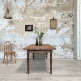 Vintage farmhouse table with turned legs.