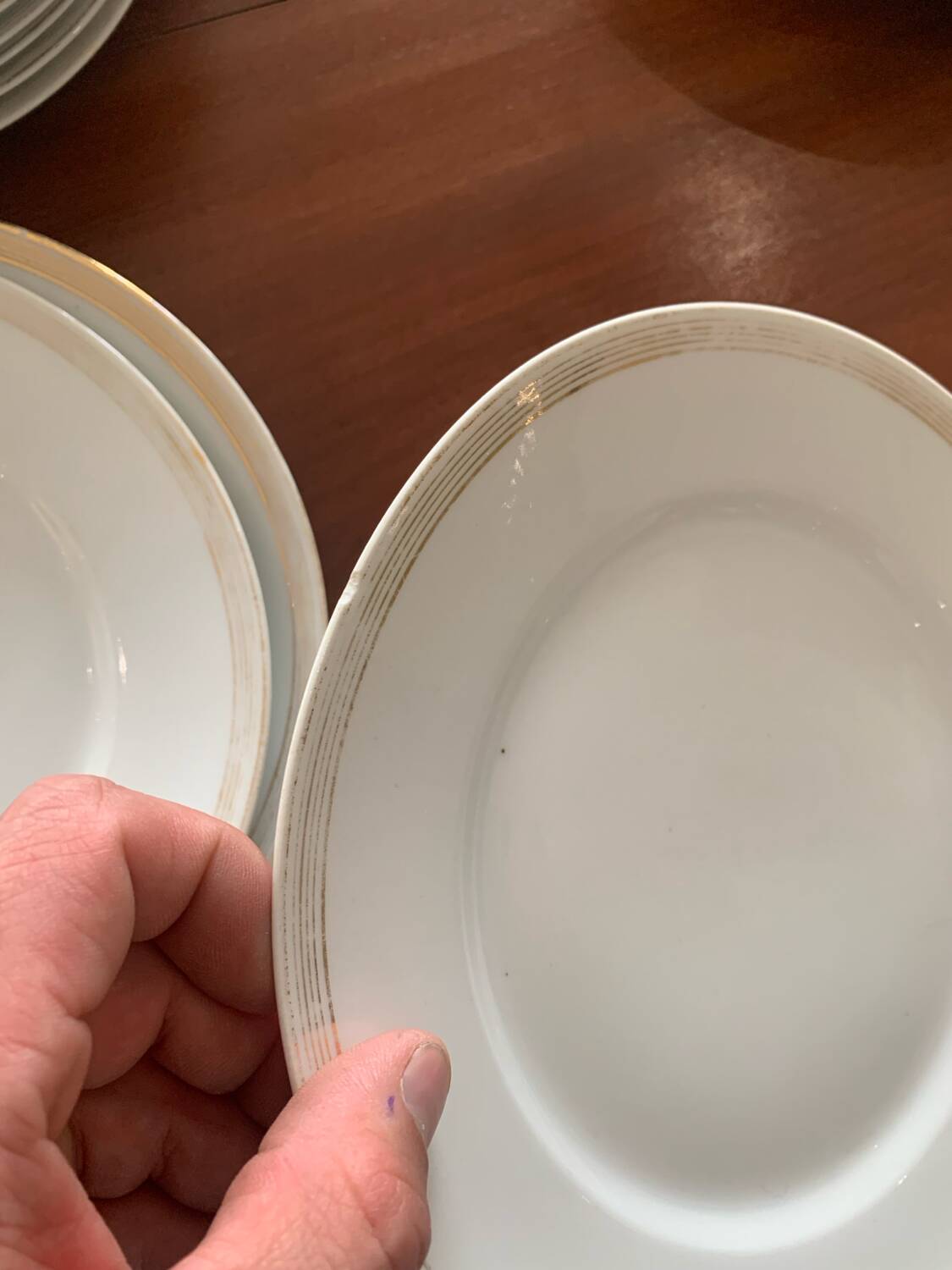 Lot of six flat plates, crockery, old white, gilded