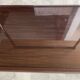 TV stand on casters, 2 brown Formica shelves, 1960s