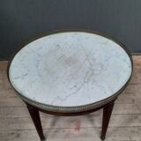 Tablr low dessu marble called "hot water bottle"