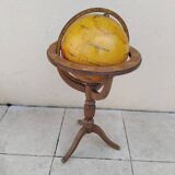 Old terrestrial globe world map on wooden stand
