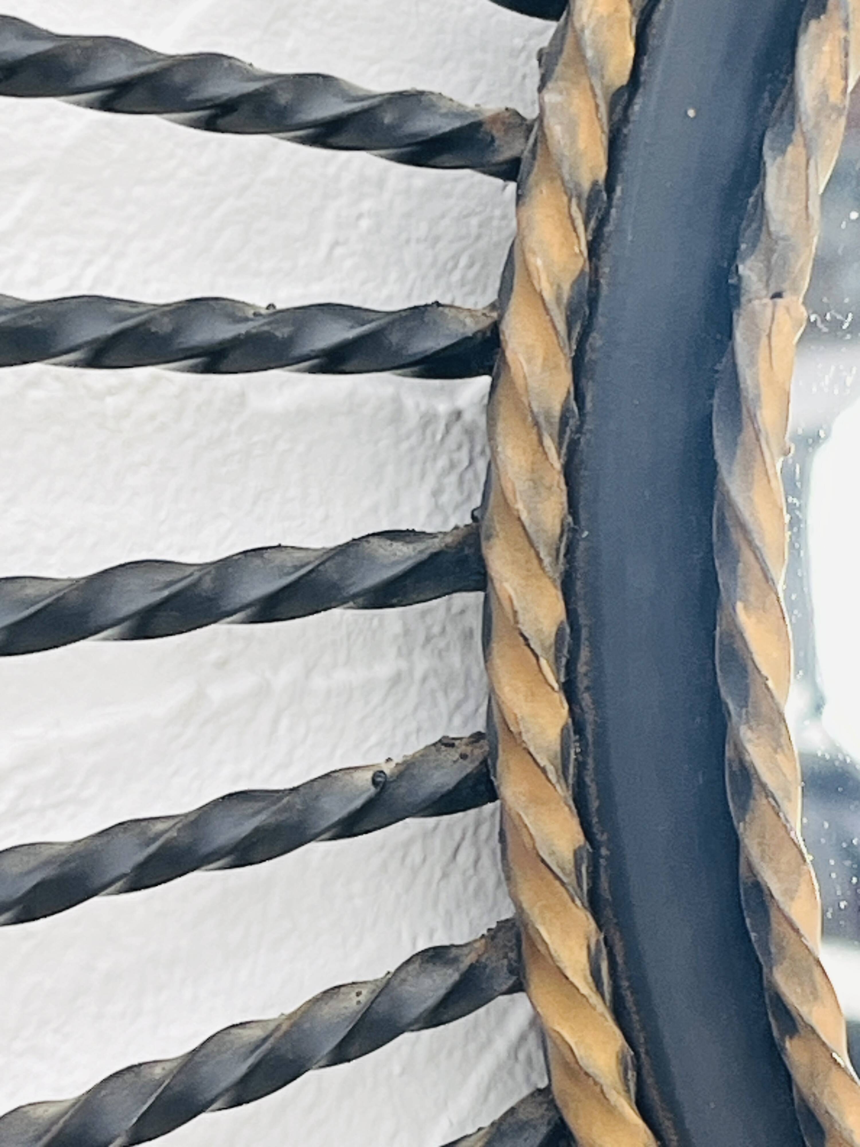 Vintage black and gold metal sun mirror from the 1960s.