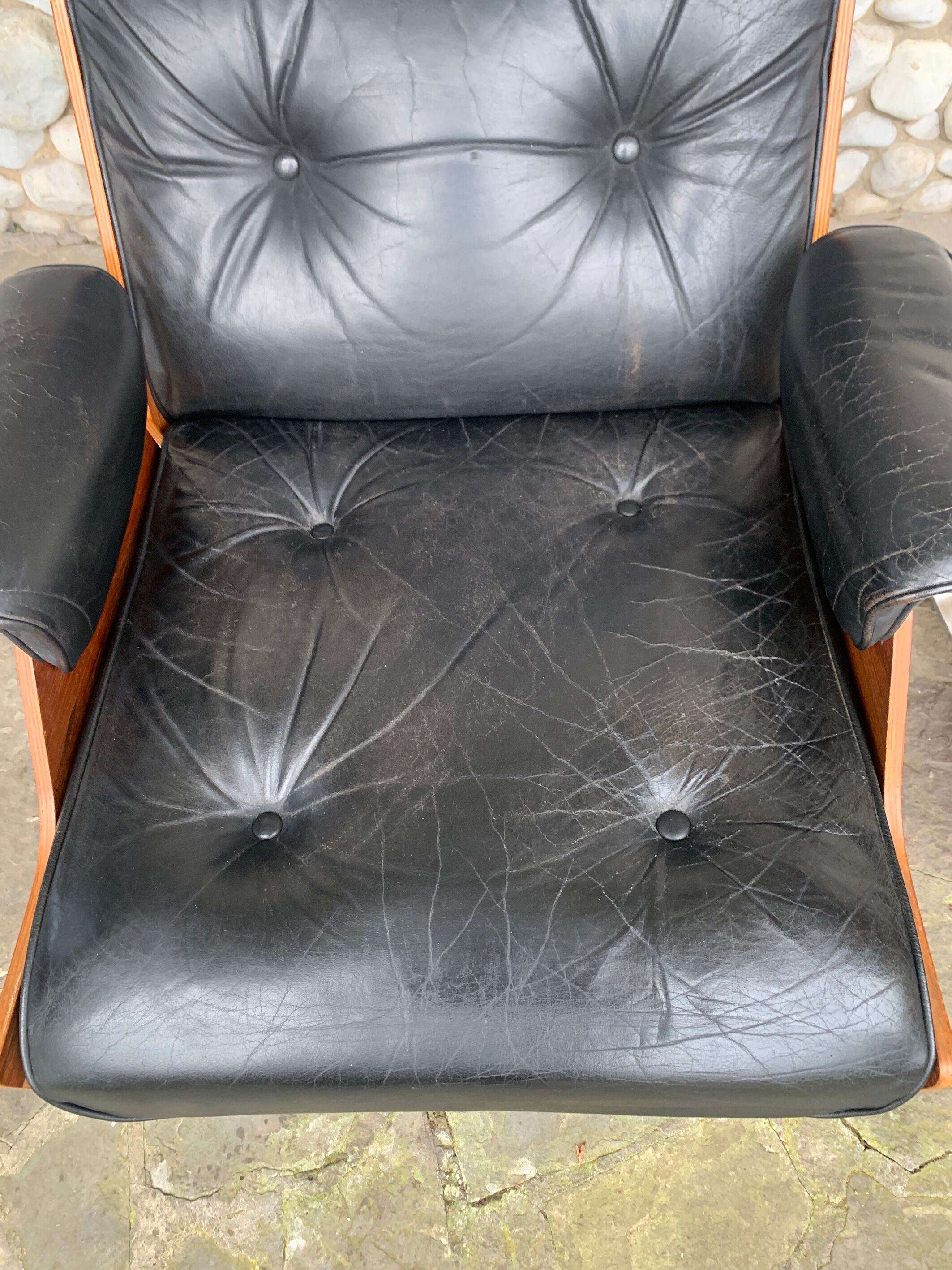 Lounge chair and ottoman black leather and teak multiplex, 1960