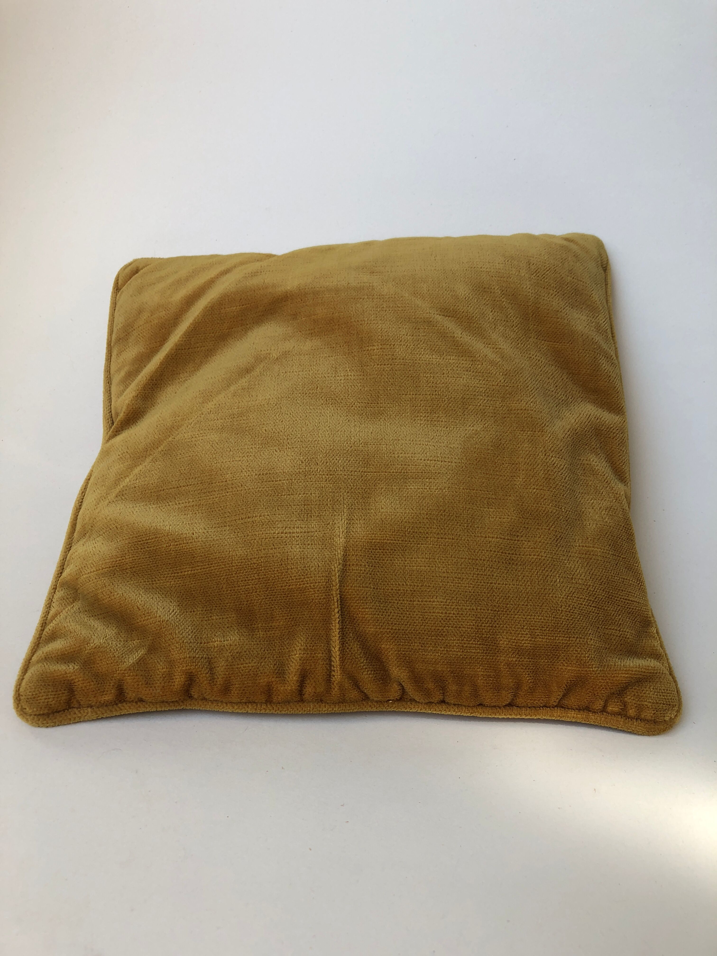 Golden yellow color velvet cushion