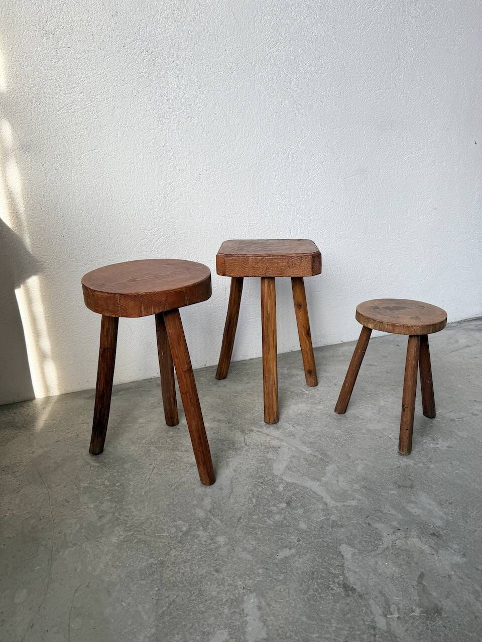 3 free-form oak tripod stools