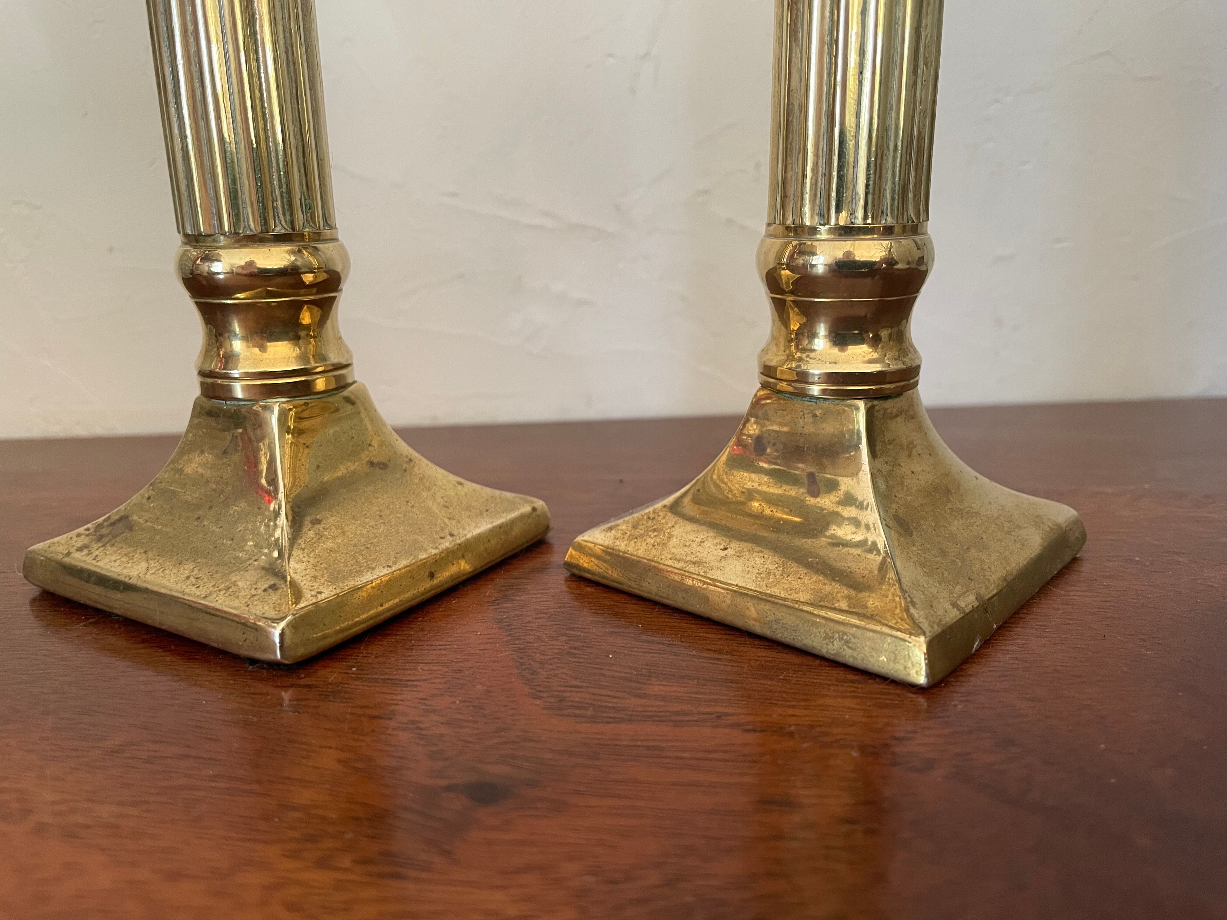 Pair of brass column candle holders