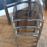 Trundle table in tubular steel and smoked glass
