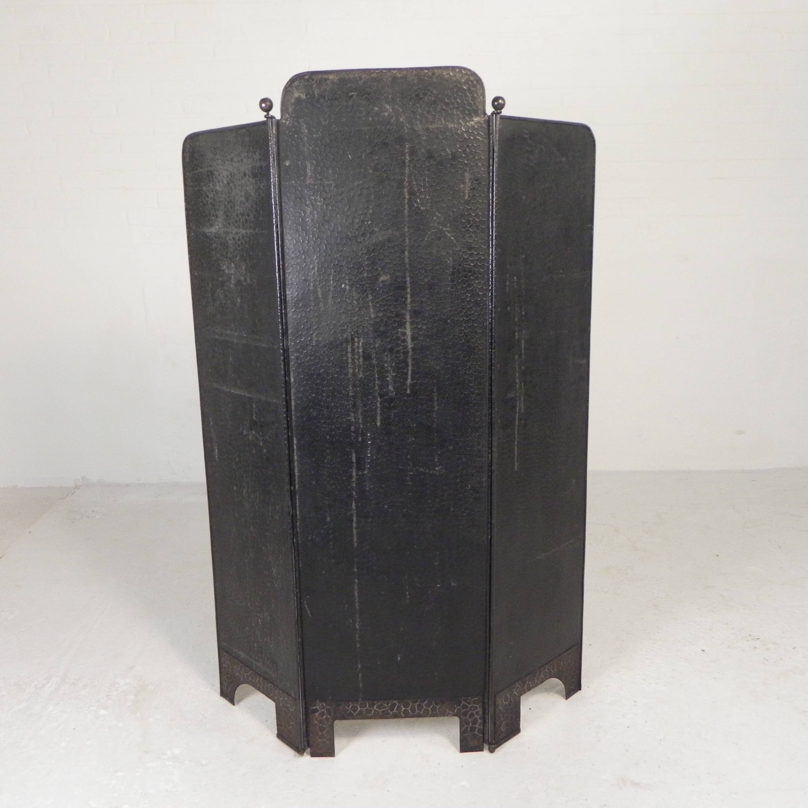 Art Deco screen in steel with brass details, 1930s.