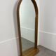 Miroir à tablette cerclage bois, forme ogive, années 60