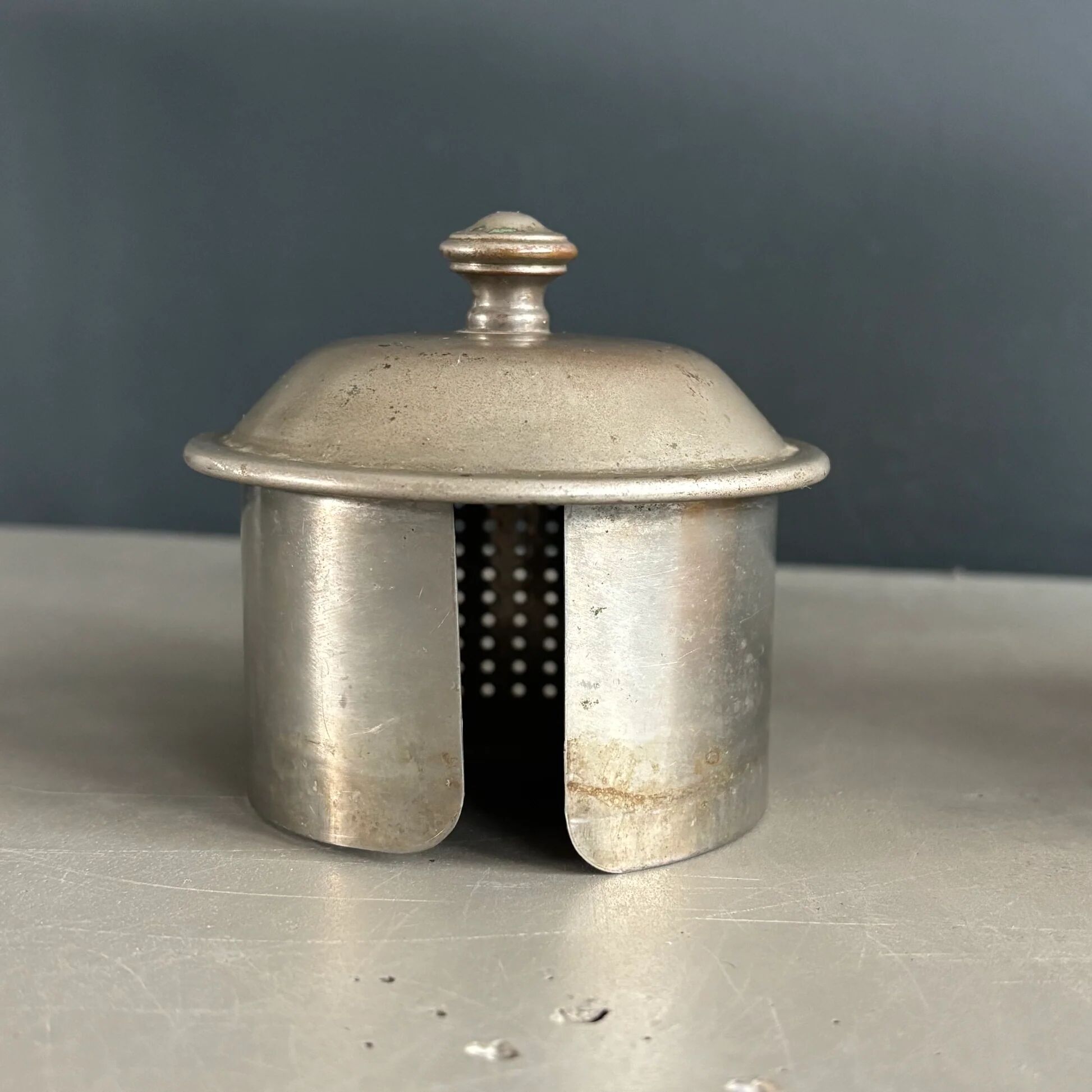 Antique teapot in earthenware with a tin filter lid.