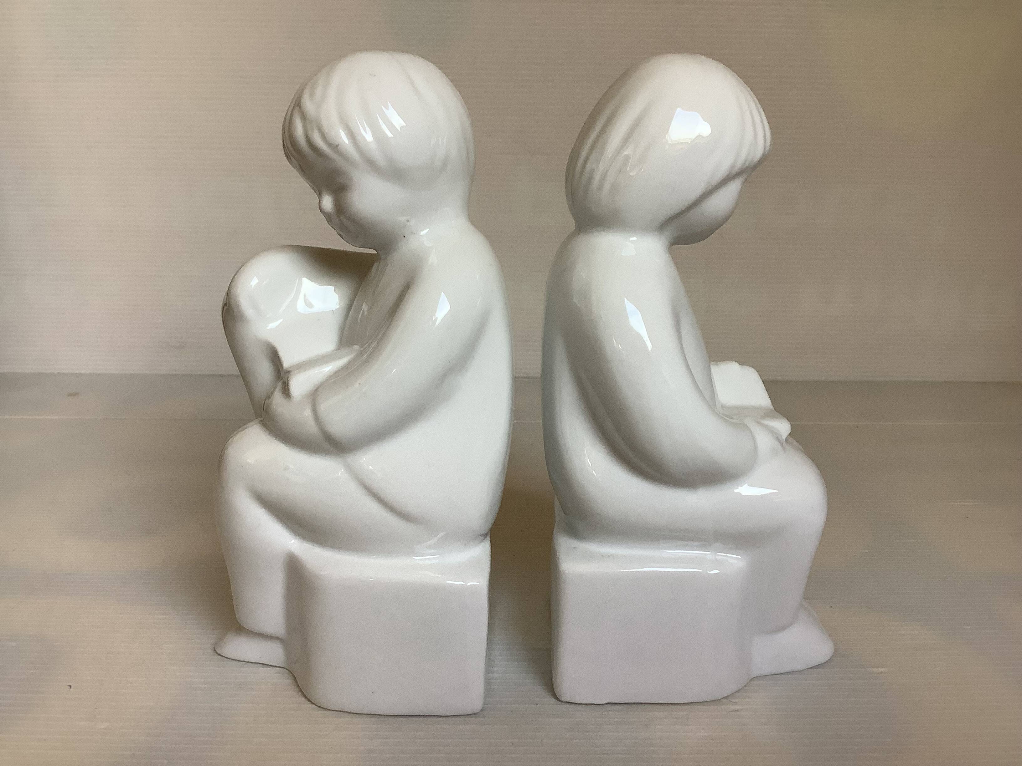 Pair of bookends featuring children reading from the 1970s.