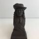 Pair of cast iron andirons in the likeness of a musketeer