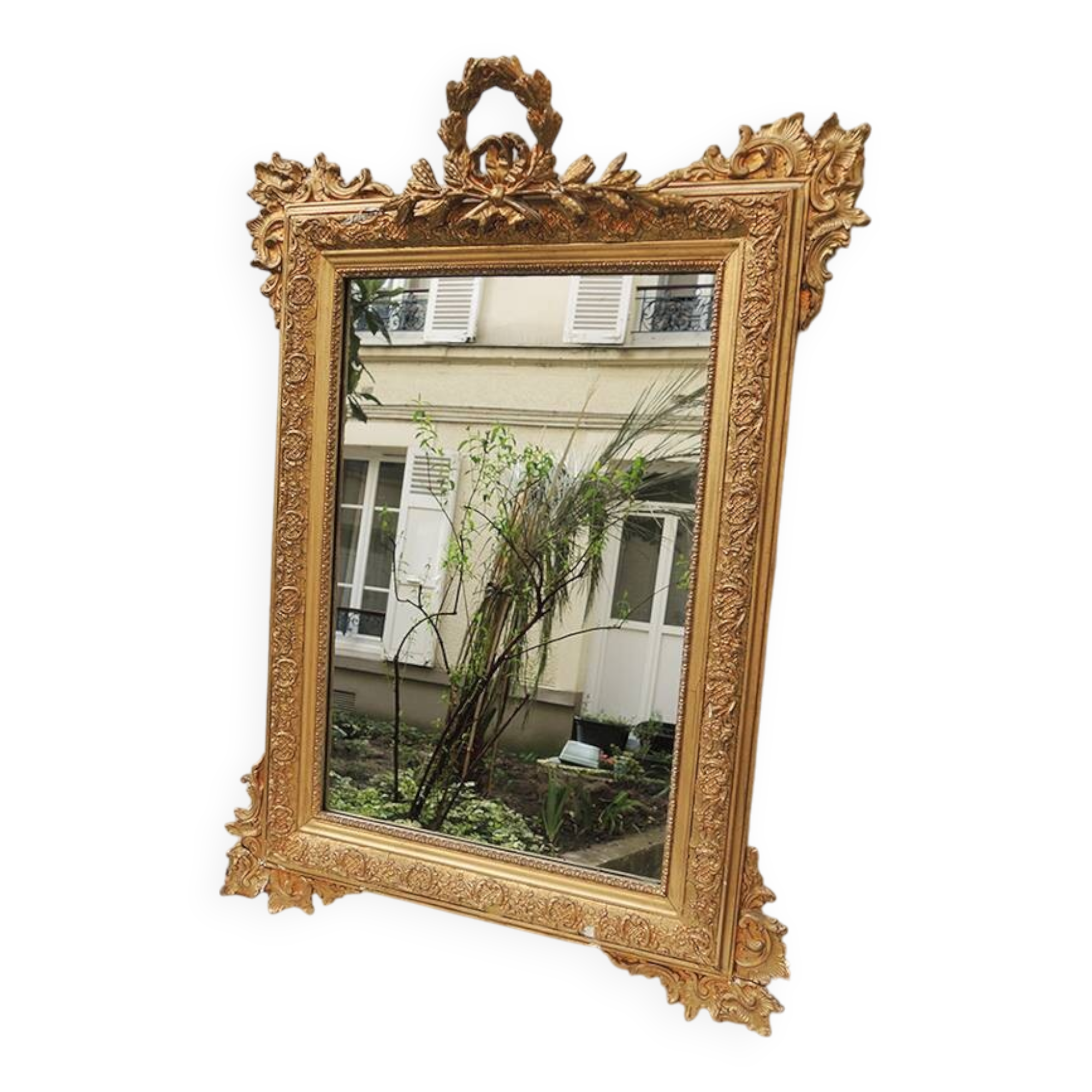 Old wooden and gilded stucco mirror