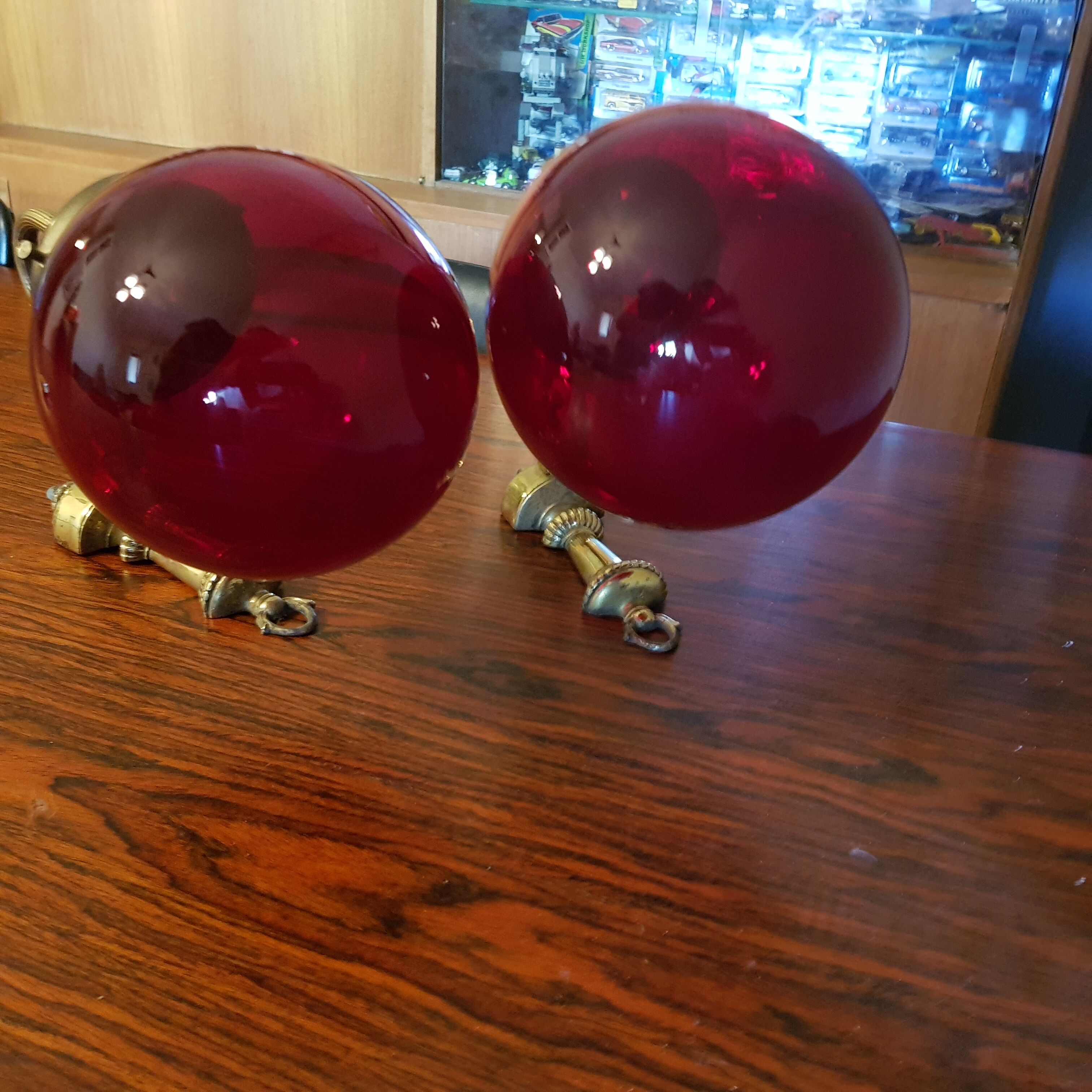 Pair of vintage brass wall light and cherry red globe