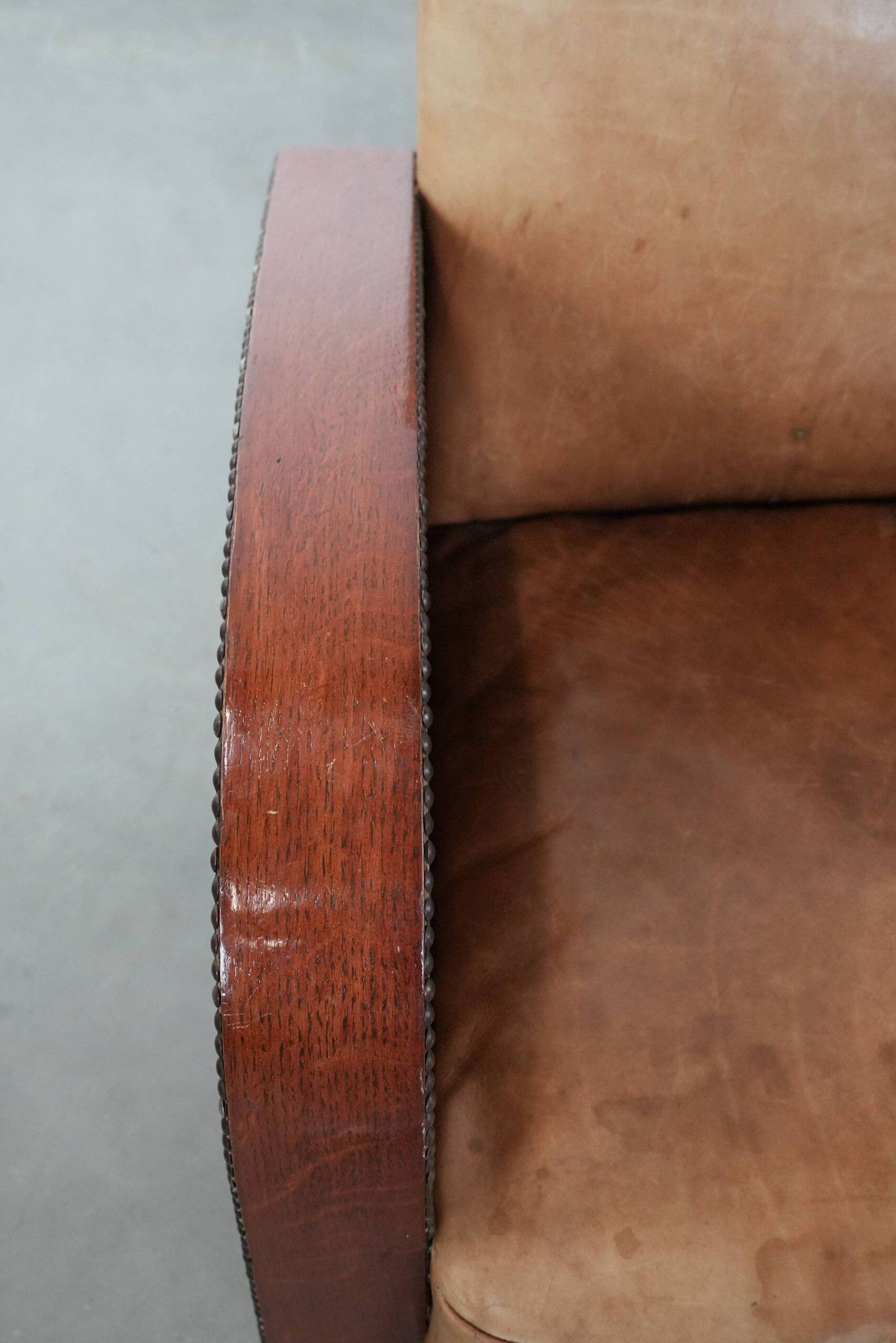 Art Deco design armchair in light cognac cowhide leather.