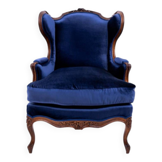 Fauteuil ailé bleu marine, France, vers 1910.