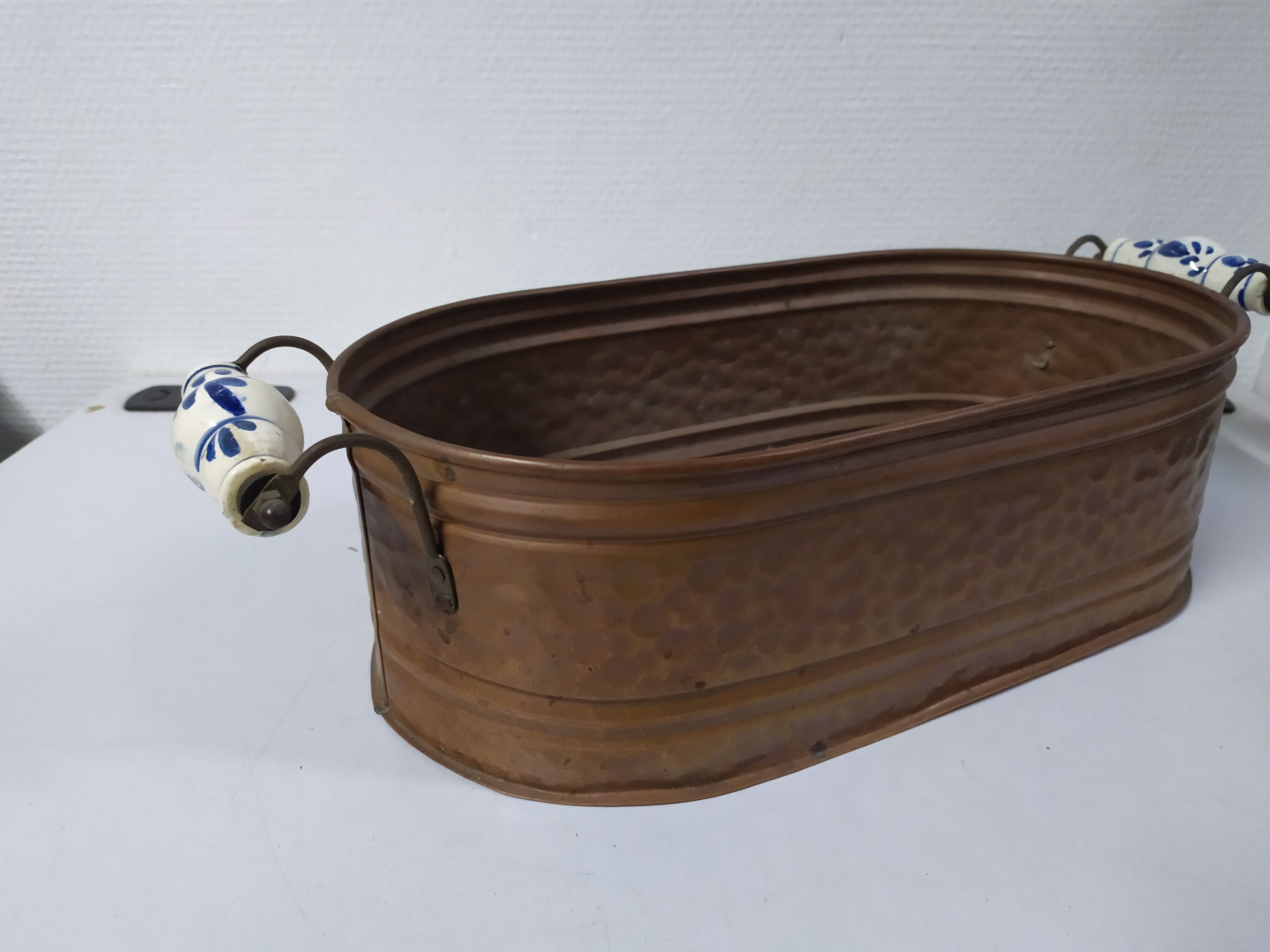 Copper planter with porcelain handles