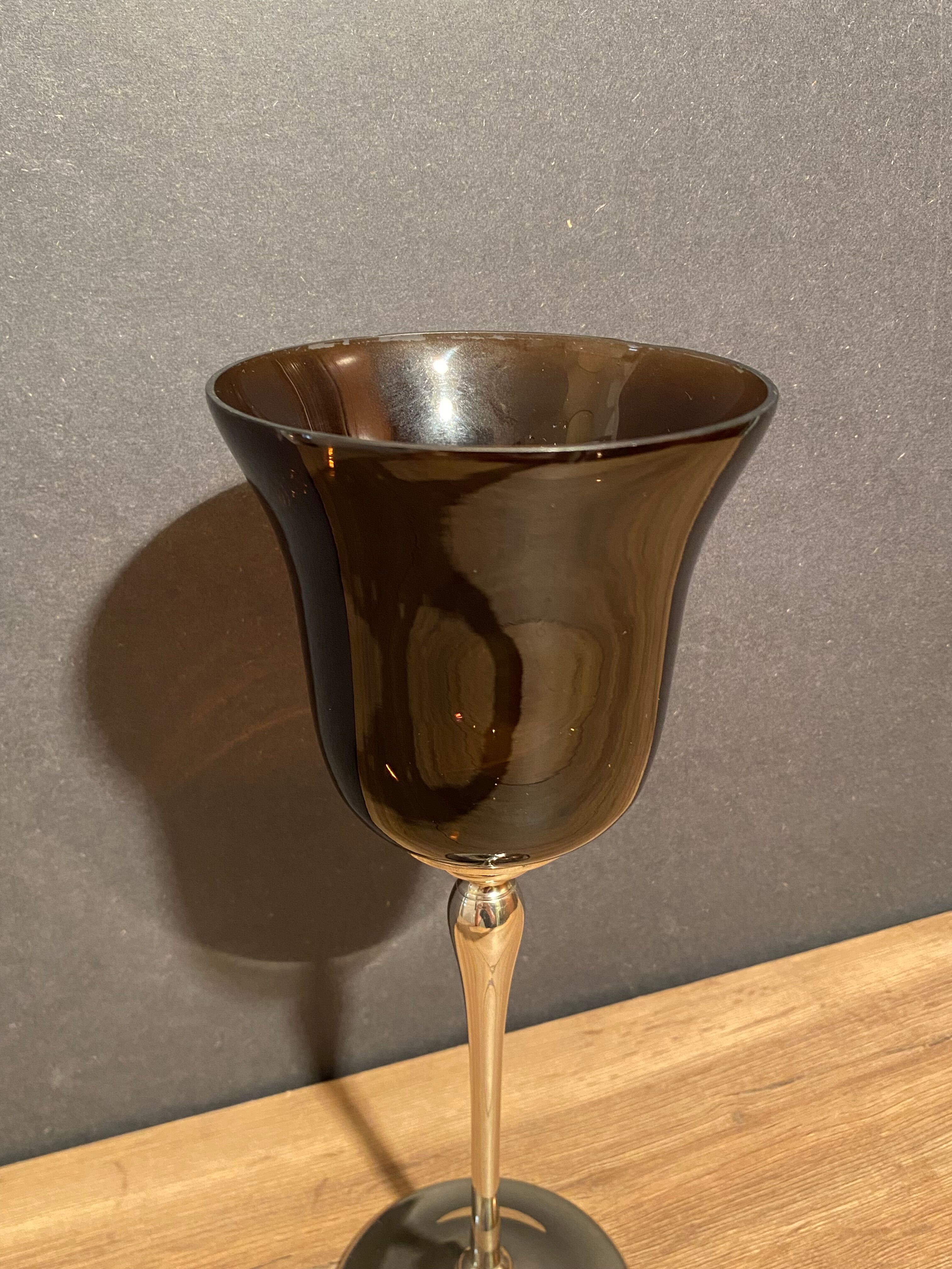 Photophore in tinted glass on high metal foot with silver patina