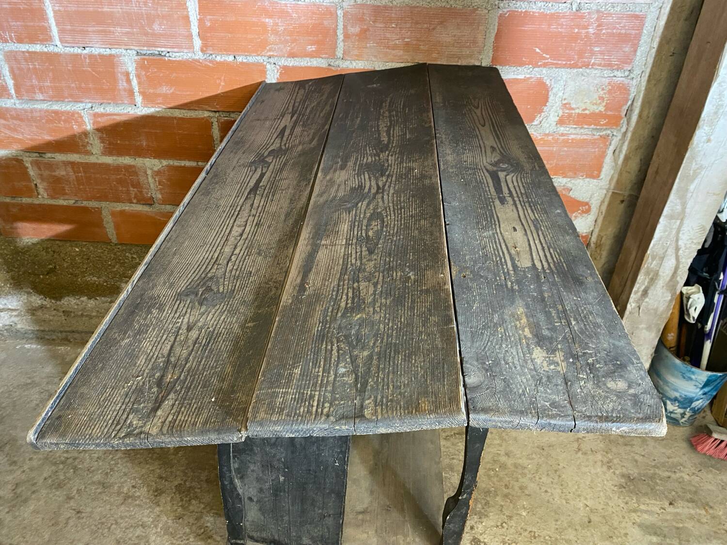 Antique writing desk, blackened wooden filing cabinet.