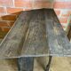 Antique writing desk, blackened wooden filing cabinet.
