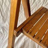 Old varnished wooden folding chair for children