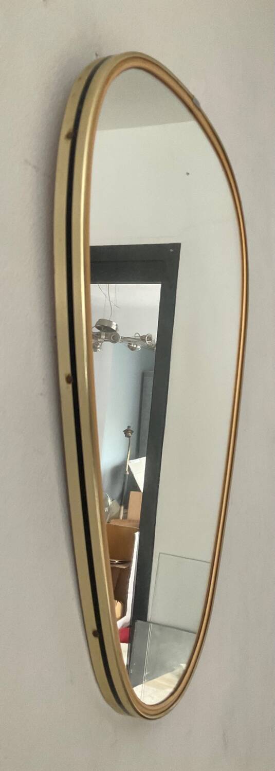 Asymmetrical free-form mirror from the 60s and 70s