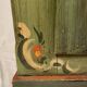 Alsatian bonnet maker in painted softwood with floral decorations