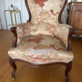 Violin-backed cabriolet armchair, in the Louis XV style.