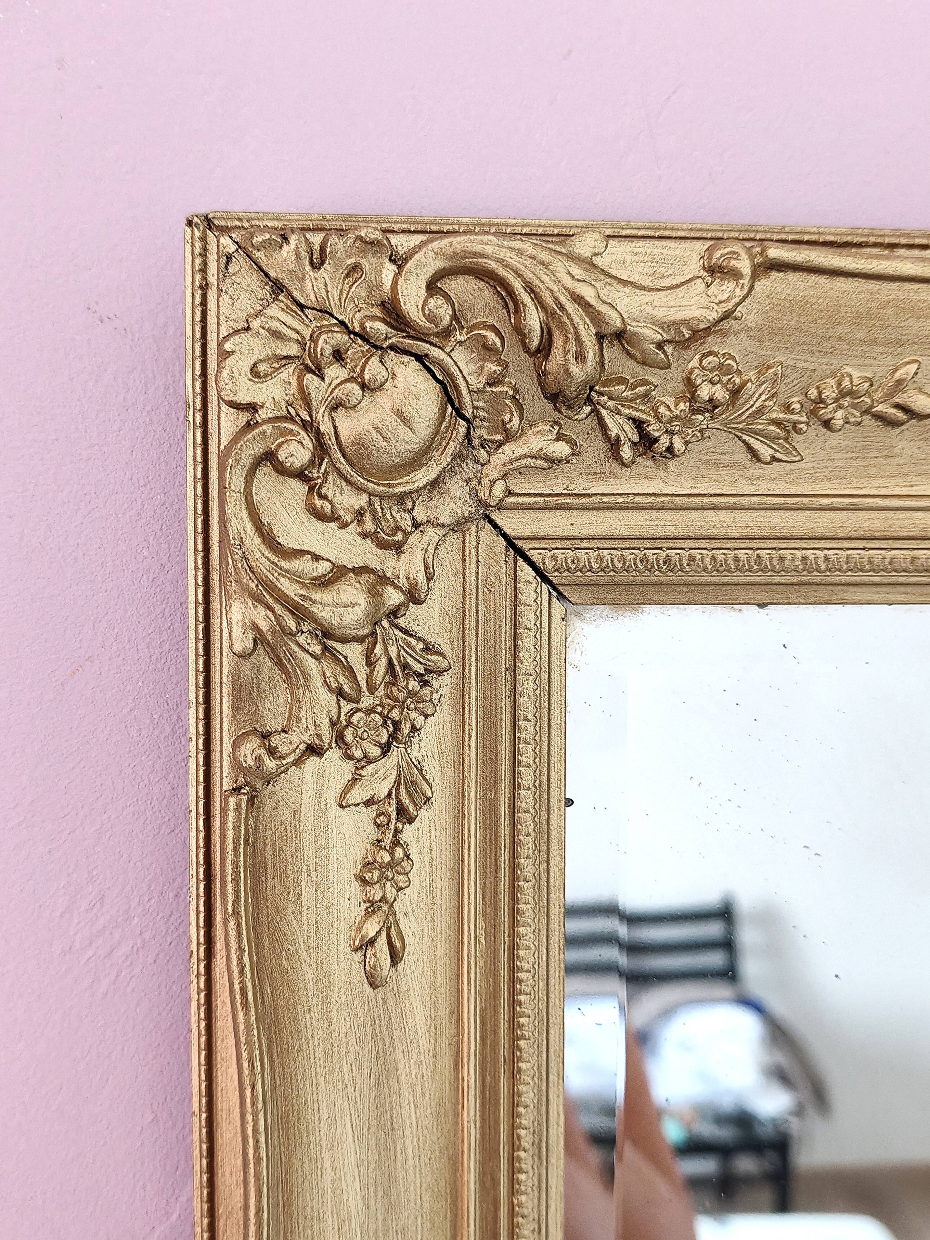 Richly carved antique gilded mirror