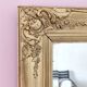 Richly carved antique gilded mirror