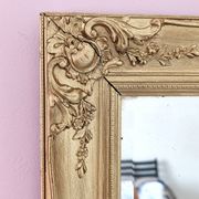 Miroir ancien doré richement sculpté